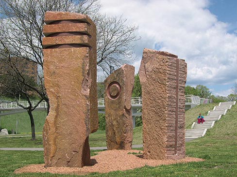 Made from Wausau Red Granite, “Sentinels” was carved for the Brady Street Bridge Project, Milwaukee, Wisconsin in 2005. All three are approximately 15 feet tall, 4 feet wide and 4 feet deep. 