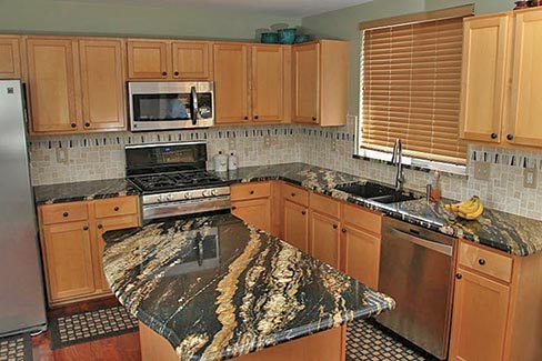 This Supreme Fantasy Granite kitchen is a good example of the everyday quality of work the company performs. Producing an average of 30 kitchens per month, they also provides vanity tops and tub decks to their growing customer base.