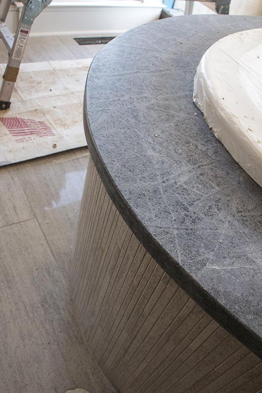 This in-progress master bathroom will feature four slabs of soapstone, and the shower will have a 16-foot curved soapstone bench. Brown’s CNC leaves a uniform, smooth, clean cut on the rounded edges of the soapstone shower bench. 