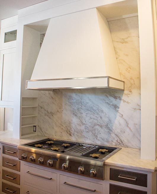 White Imperial Danby marble is featured throughout the ground floor kitchen and den area of this home. Brown is responsible for making each template.  Although straight cuts were used in many of the projects, there is a lot of marble in this house - $68,000 worth so far, and the project keeps growing.