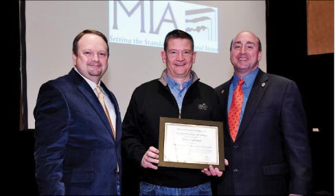Left to right: Rodney Harvey presents John Beiersdorfer (center), President of Sims-Lohman, with his MIA Accredited Fabricator certificate, assisted by 2014 MIA President Tony Malisani.