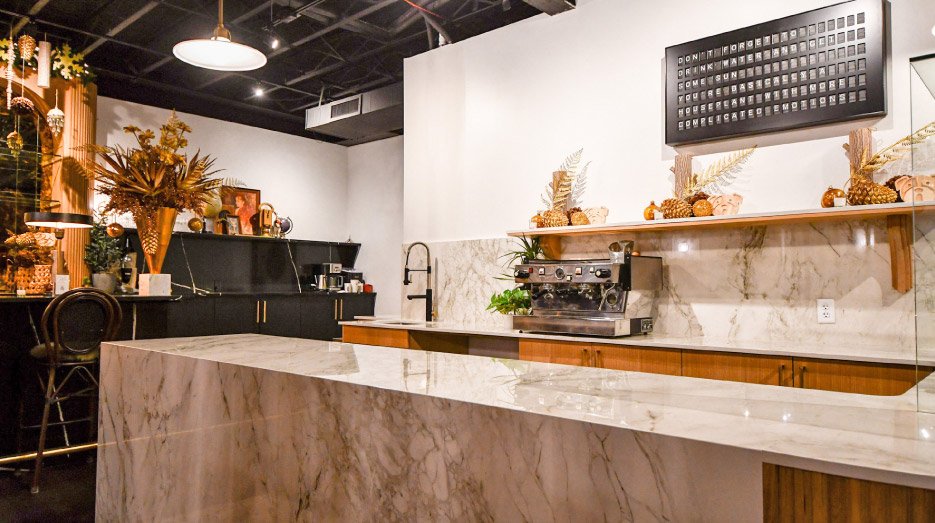 This commercial job for The Monocle features a mitered dekton island with waterfall edge. Hora: “We did a miter and then transitioned to square and transitioned to a mitered edge again, to complete this showpiece top.” 