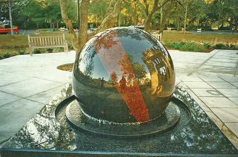 This Cordova Creme limestone structure was fabricated by Southern Granite Company, Inc., for a scenic meditation area on a lake-island park on the grounds of the Mayo Clinic hospital in Jacksonville, Florida. The Southern Granite Co. also supplied the granite ball fountain. The lattice is approximately 17x17 foot, with the upper segments supported by three columns set on 18 inch-high, rectangular bases, one free-standing. Set on angles, no two exactly alike, it weighs 126 tons and can withstand winds up to 180 miles per hour.
