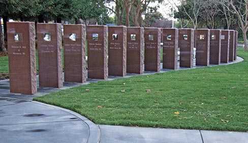 The flagpole is set in a base decorated by the artwork of children whose drawings were glazed onto ceramic tiles. A serpentine row of “Wausau Red” tablets commemorates each passenger lost on Flight 93 the morning of September 11, 2001 in Somerset County, Pennsylvania. A polished stainless steel plate is fixed in each tablet at eye level to remind viewers that any one of us could have been on that flight. EGA members donated the time, work, supplies and material.