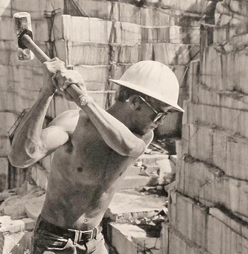 Ledgeman at work in Berkeley Quarry in Madison County, GA. The ledgemen have the essential job of guiding the drills and lining  up the shims and wedges at quarries.