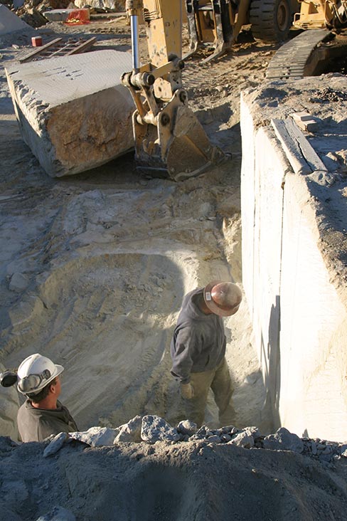 Face inspection at the Old Dominion Quarry to determine where to place the next cut.  Bottom, Right: An operator keeps careful watch on the Fantini 70S saw gauges; The 20-foot cutting bar is buried in the rock face.