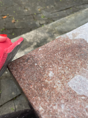 Taking a corner of the table closer to a honed state reveals the original Tennessee Pink coloration so characteristic of marble from the historic Friendsville quarry. From the time period when it was installed  (early 1900s), the original finish was most likely honed.