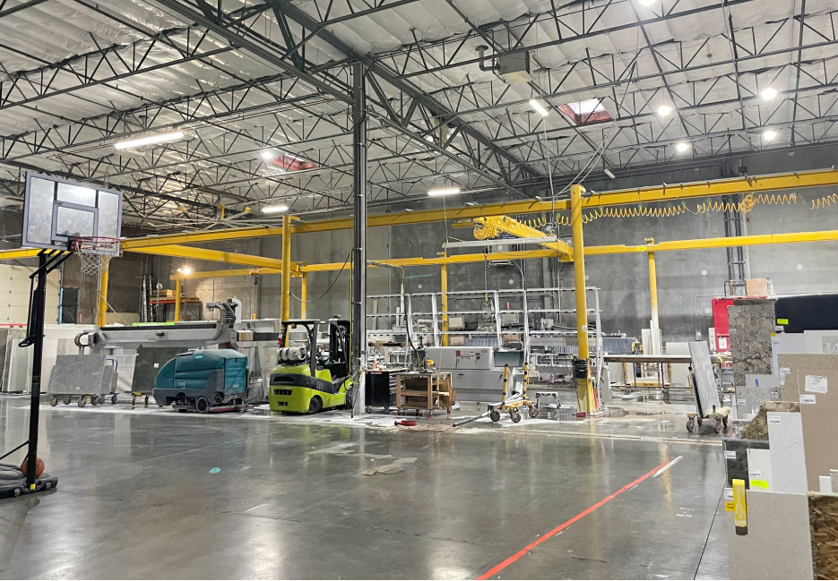 Panorama of shop floor also shows how very organized the shop is – and also a bit of the company culture.  Note the blue floor scrubber by the fork lift in the background – their secret weapon against encroaching dust.