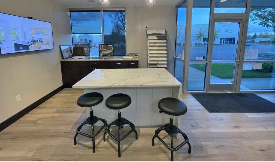 A large, high-def monitor expands the limited display space in the showroom by showing project samples and more. 