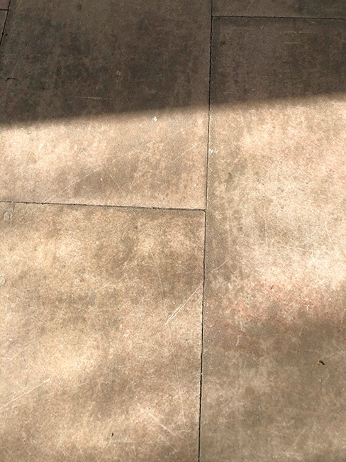 This Limestone flooring needed both cleaning and honing. Note the lippage at the corners, a common issue with many types of natural stone flooring.