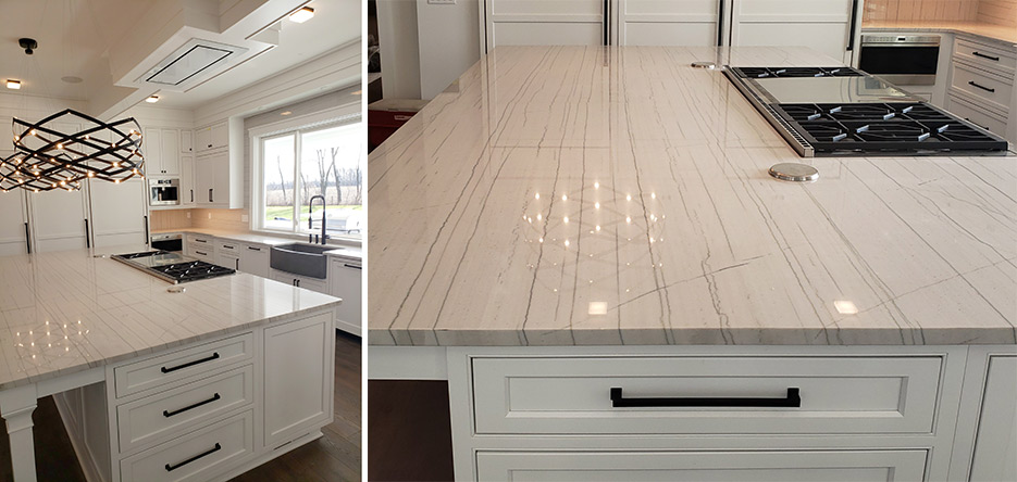 White Macaubas Quartzite kitchen includes a built-in farmhouse sink, a full-height backsplash around the windows, and pop-ups on the large island. McDermott Top Shop used Slabsmith to align the veining in the island.