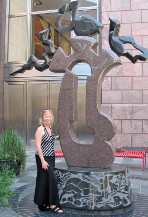 “Harmony” was fabricated at Dakota Granite in Milbank, South Dakota. Conn made a giant pattern and sent it to them. They rough cut the pieces out of Dakota Granite and Zimbabwe Granite. Says Conn, “I arrived and spent a month with a 50 lb. grinder shaping and contouring the pieces. Dakota Granite made the base. The whole sculpture was shipped directly to Charlotte, NC where we installed it ourselves at the Blumenthal Performing Arts Center. It looks as good today as it did the day we installed it in 1996. The snake, the fish and the bird represent earth, water, and sky, and the large cut-out figure represents ‘mother earth.’ It is all about harmony in the universe.”