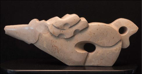 “Hot Brown,” carved from Kentucky limestone. Not a standard stone used for sculpture, Julie says that she has discovered that Kentucky limestone polishes beautifully, and often reveals hidden veins and streaks of color that give her new pieces great texture and visual interest.