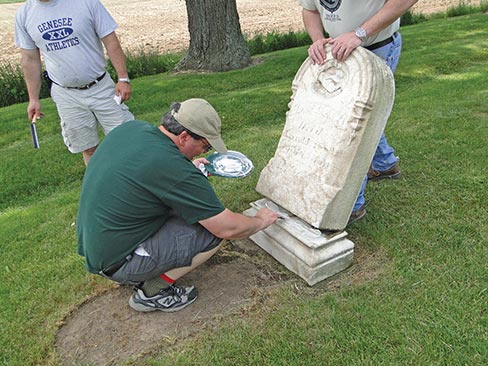 Resetting a monument on a solid foundation with a strong epoxy