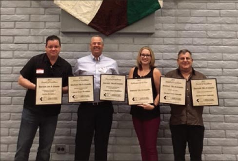 Stockett Tile and Granite employees accepted the awards. (From left to right) Ryan Sullivan, Mark Costilow, Ciara Raber and Larry Caine.