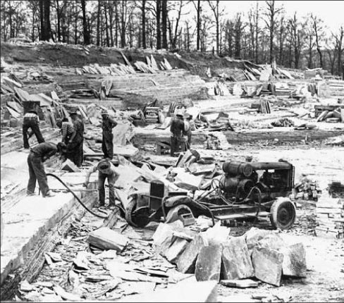 Quarrying Crab Orchard stone at a Cumberland County site, circa 1948, when powered machinery like this hydraulic drill was first coming into use. 