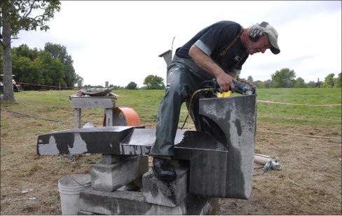 Artist and mason Dan Ucci hard at it at the First Viles Arboretum Sculpture Symposium in Augusta, Maine during September of 2014. Dan also sits on the committee that began the concept of producing stone sculpture on the premises. 