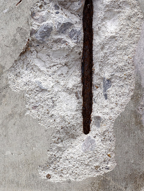 The soft water was eating away at the marble, causing it to spall and pit