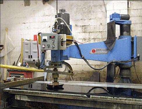 A radial arm polisher is an important machine in many fabrication shops. Here, an old reliable Sawing Systems machine restores a slab back to a factory polish.