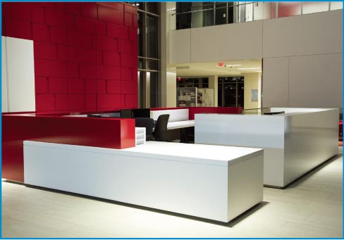 Quartz countertops and divider walls for a modern corporate lobby.
