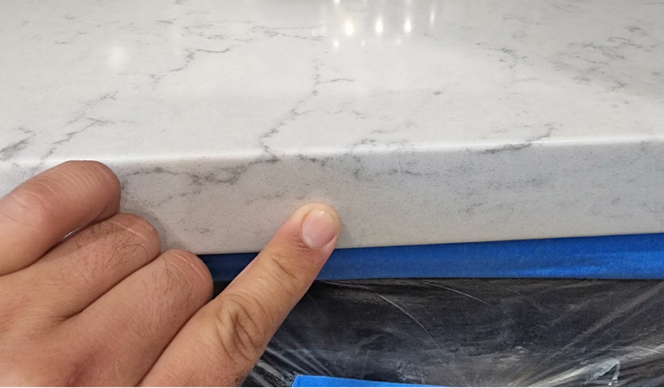 The Granite Gold Countertop Protection Plan covers the repair of chips and other accidental damages at no additional cost to the customer. Here is one of their methods to achieve a superior repair to a quartz countertop chip: color matching the repair epoxy, polishing, and cleanup.