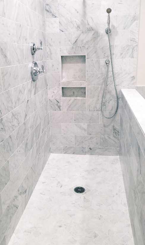 This marble shower floor was installed using the epoxy method by Pavlo “Pasha” Starykov.