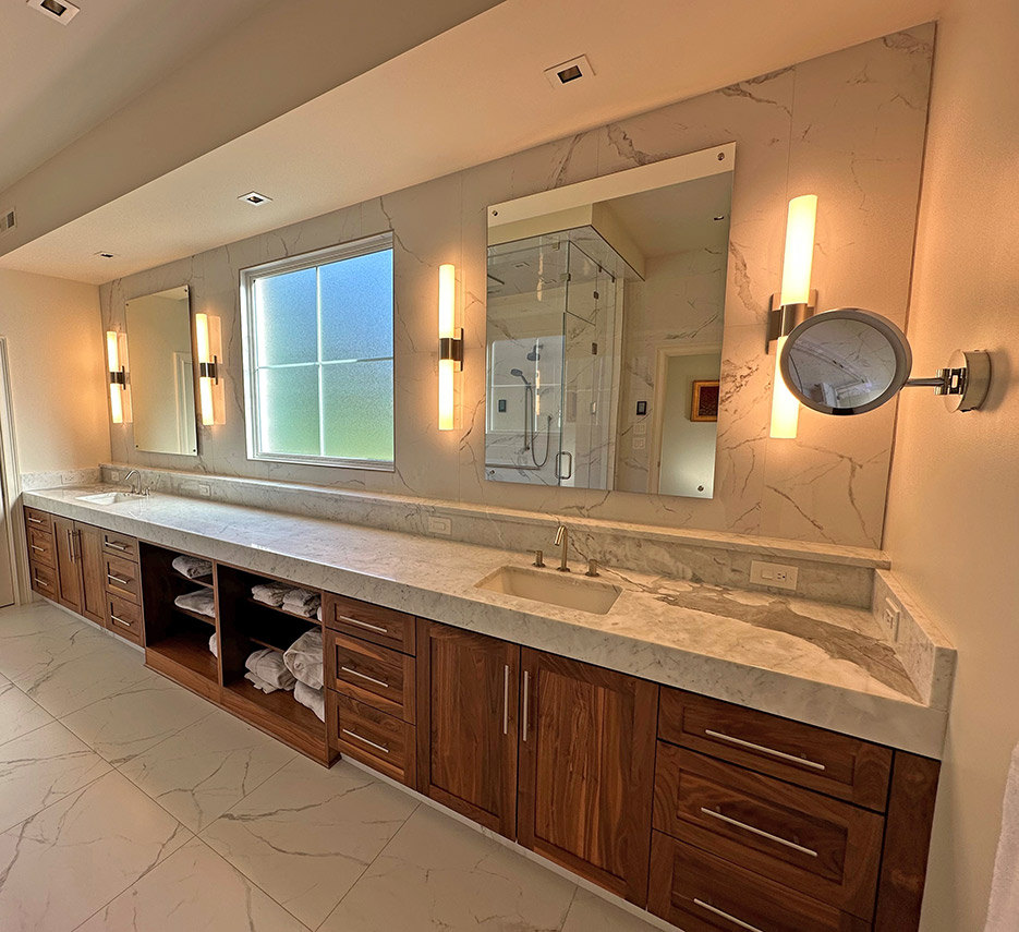 The extra-long marble double vanity was also honed and re-polished.