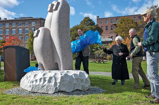 Japanese artist Koichi Ogino’s “Camel Country” is unveiled by Bangor City Council Chairman Cary Weston and John Rohman at the Bangor Waterfront. 