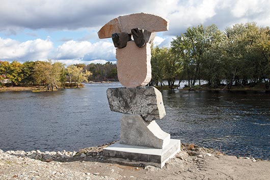 Standing tall on the riverbank of the Penobscot River in Old Town Maine, Netherlander Ton Kalle used five different granites in the playful “All Along The Watchtower.”