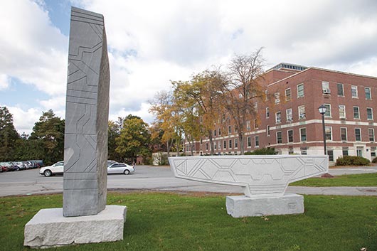 Bigger than life, “Man And His Dog Walking Into The Forest” by artist Tim Shay of Maine are displayed at University of Maine’s Nutting Hall.