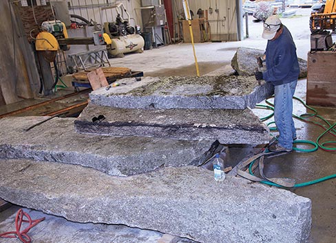A rustic cascade of local stone steps get a final fitting by Sculptor Russ Kaufman. “Russ is an independent contractor and sculptor that does marvelous things as well as invent machines to do this type of work,” said Jeff Gammelin. “He’s here almost all the time and he can build from architect plans or sometimes just draw it out and produce it.” 
